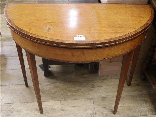 A George III rosewood banded satinwood demi lune card table, W.93cm